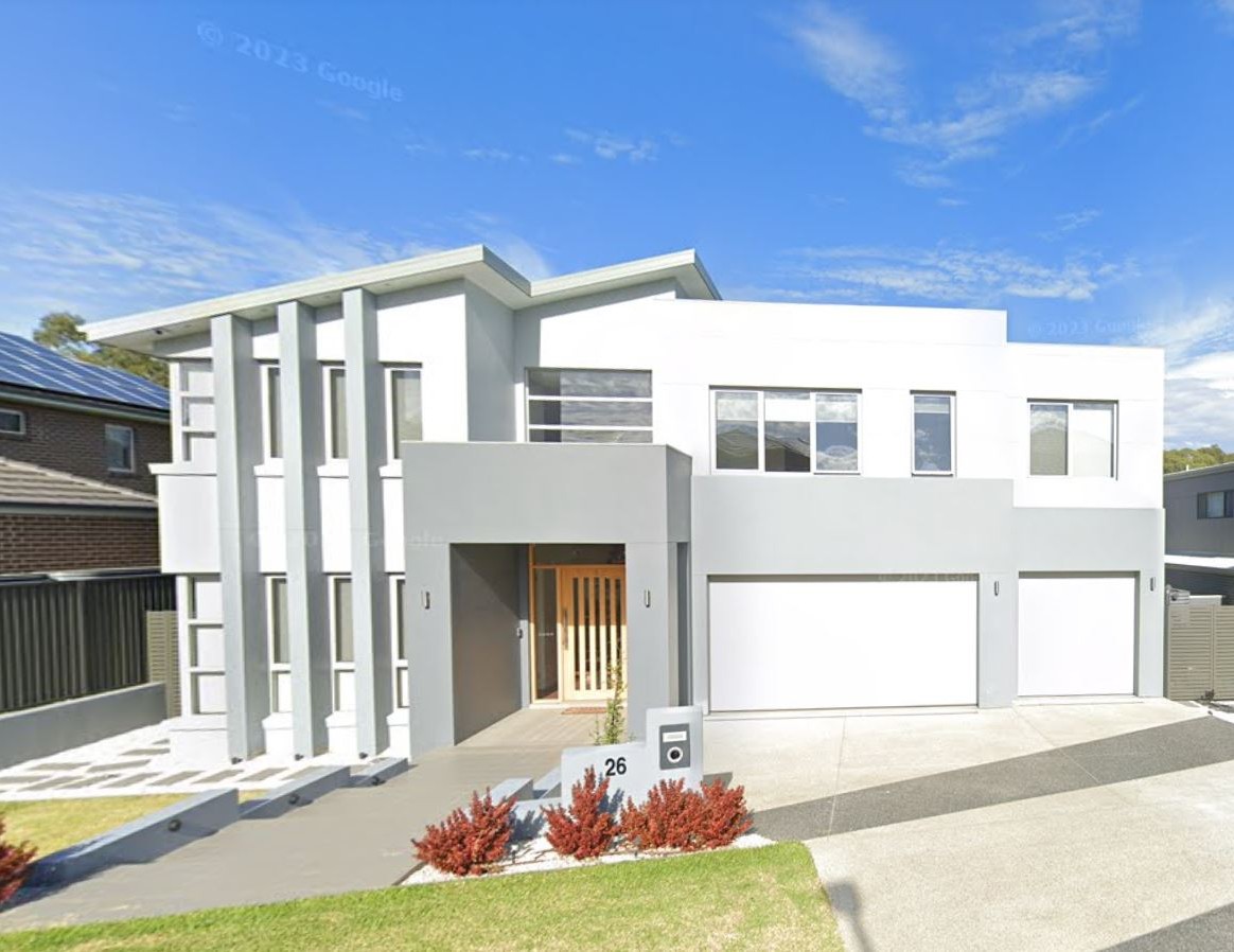Kellyville — Modern flat-roofed residence with rendered facade